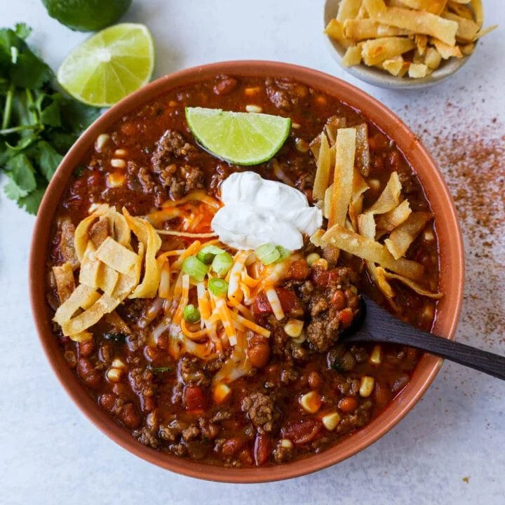 Quick and Easy 30-minute Taco Soup Recipe has all of the flavors of tacos made into a soup!