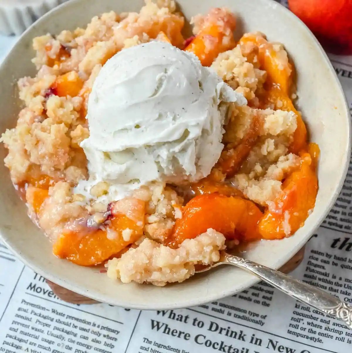 This Homemade Sugar Cookie Peach Cobbler is made with juicy peaches tossed in sugar and topped with a soft, buttery sugar cookie crust, then baked until golden. Serve it warm with a scoop of vanilla ice cream for the best peach cobbler recipe with a sugar cookie twist!