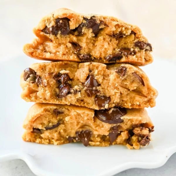 Rich, thick, and soft, these peanut butter chocolate chip cookies taste just like Levain Bakery but made at home. These Levain Bakery Peanut Butter Dark Chocolate Chip cookies are the perfect soft peanut butter chocolate chunk cookie!