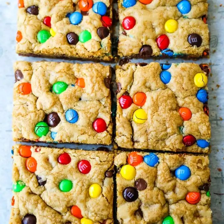 M & M Cookie Bars Soft chewy brown sugar M & M blondie cookie bars. The best M & M Cookie Bars recipe! www.modernhoney.com #bars #dessertbars #chocolatechipcookiebars