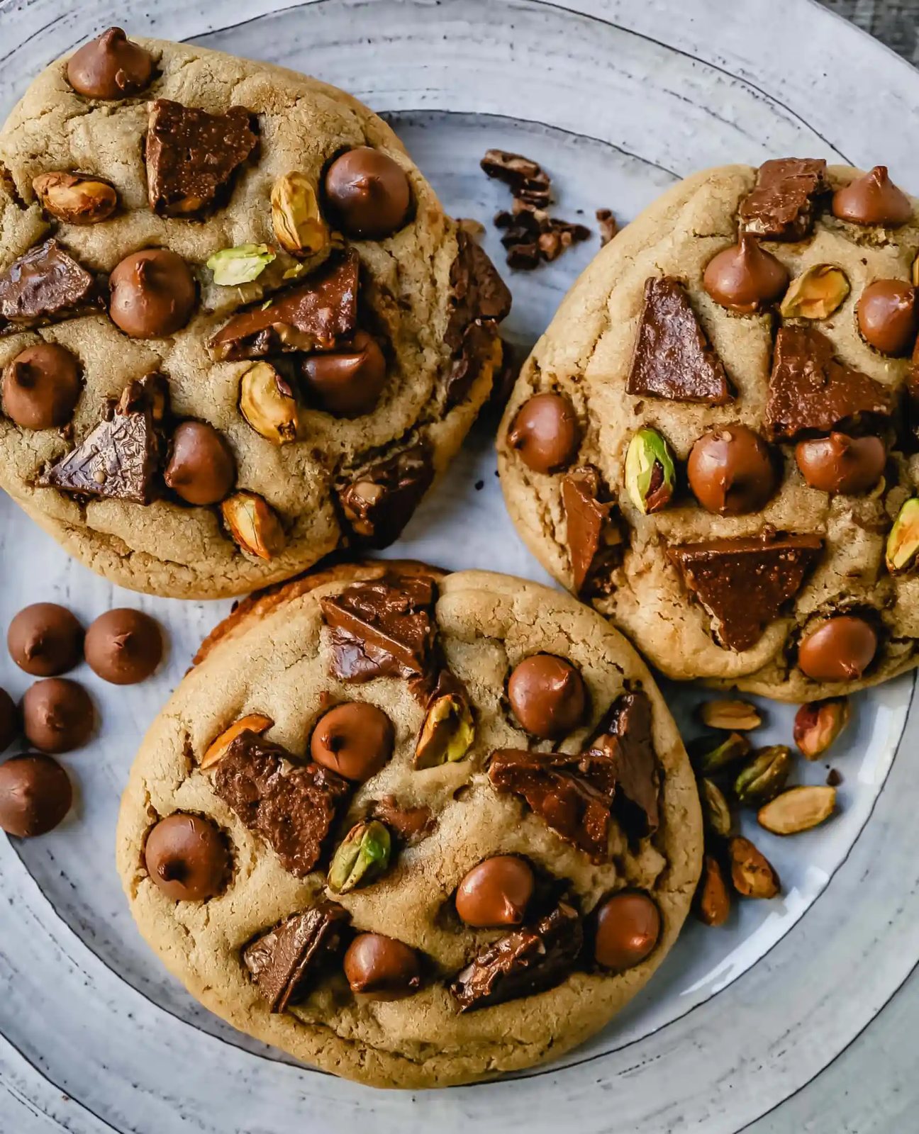 Pistachio Toffee Chocolate Chip Cookies Thick, chewy bakery-style cookies with milk chocolate toffee, pistachios, and milk chocolate chips. A sweet and salty cookie!