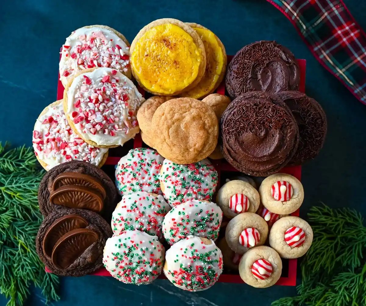 Christmas Cookie Box. Christmas Cookies include snickerdoodles, chocolate frosted cookies, peppermint frosted cookies, candy cane kiss cookies, chocolate orange cookies, creme brulee cookies. How to make a Christmas cookie box.