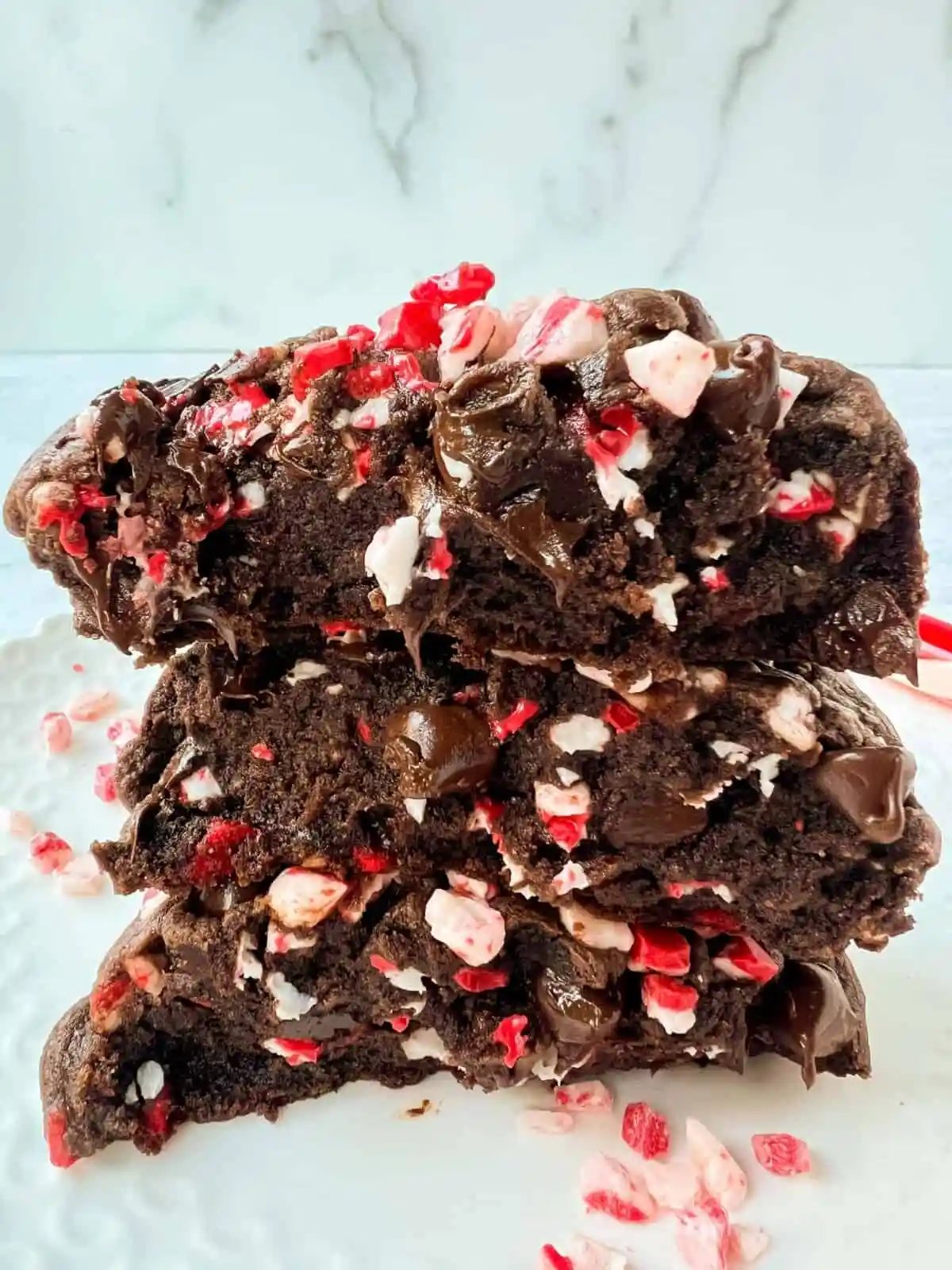 Thick, soft, chewy bakery-style chocolate peppermint cookie recipe. This Levain Bakery Chocolate Peppermint Cookie is made with a rich double chocolate cookie and peppermint chips. The perfect Christmas cookie recipe!