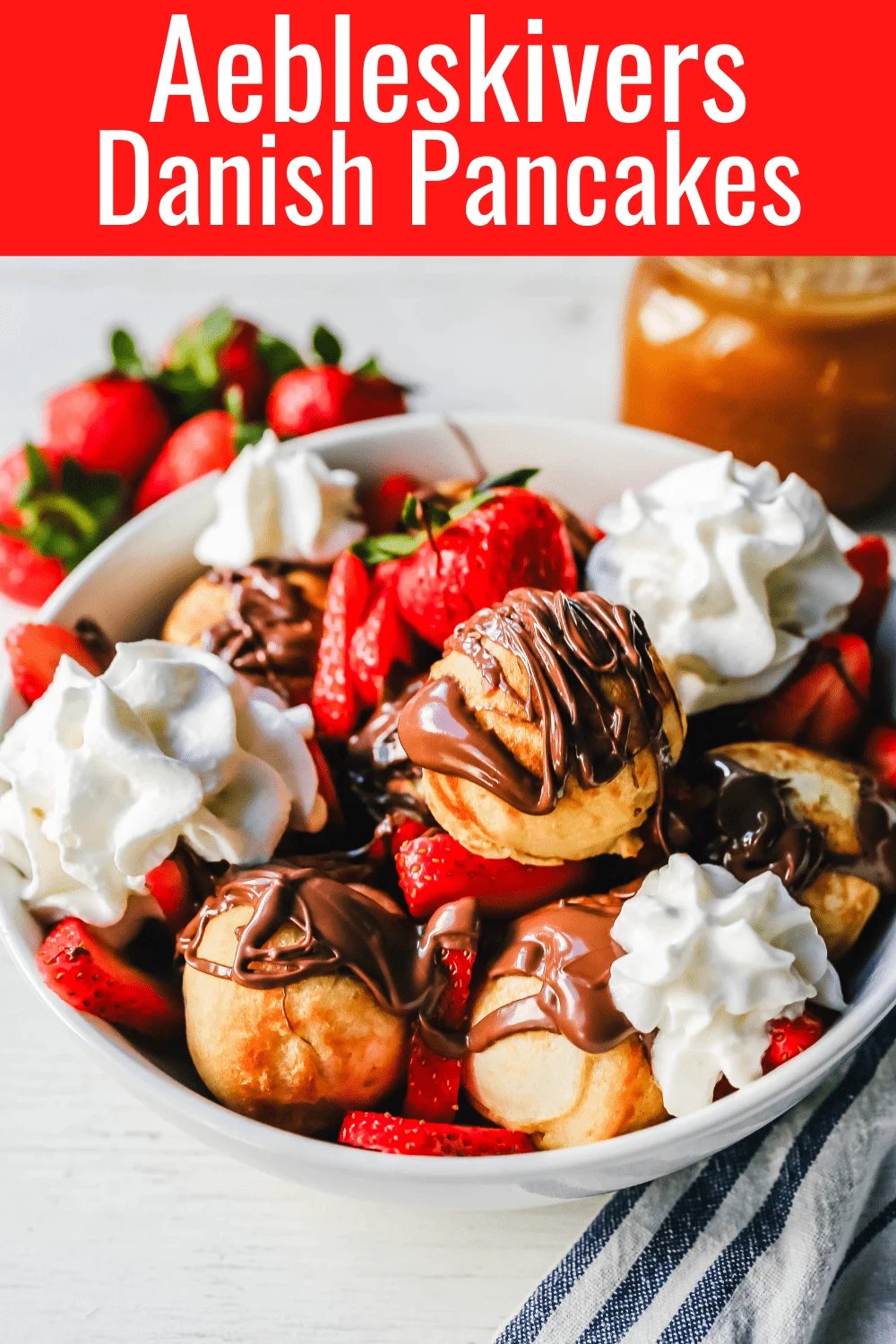 Aebleskiver Danish Pancakes a traditional Danish breakfast or dessert popular in Denmark is a circle pancake cooked in an aebleskiver pan and served with jam, powdered sugar, syrup, and fruit. www.modernhoney.com #aebleskivers #danishpancakes #pancakes