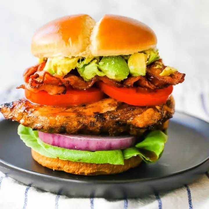Avocado Bacon Grilled Chicken Sandwich Juicy marinated grilled chicken breast with crispy bacon, creamy avocado, juicy tomato, crisp lettuce, all on a brioche bun. www.modernhoney.com #grilledchickensandwich #chickensandwich