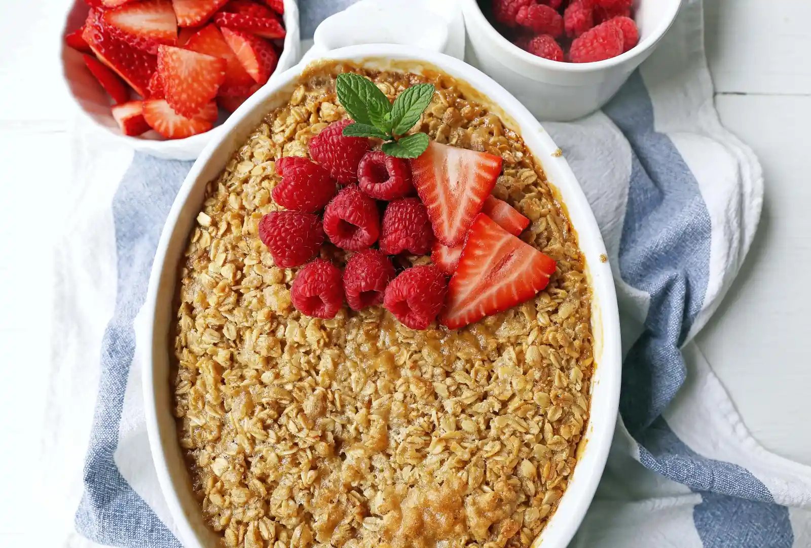 Baked Oatmeal. Brown Sugar Baked Oatmeal. A warm, comfort food breakfast is a perfect way to serve a crowd or to re-heat for those busy mornings. www.modernhoney.com #bakedoatmeal #oatmeal #oatmealbake #brownsugaroatmeal