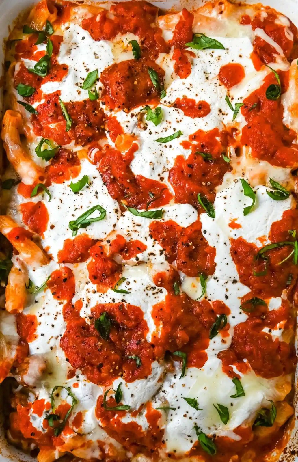 Baked Rigatoni with Sausage is a comforting Italian pasta dish that combines rigatoni, savory Italian sausage, and rich tomato sauce, all baked under a blanket of gooey melted cheese. This hearty, flavorful dinner recipe uses only 7 ingredients and is perfect for family dinners or as a make ahead dinner.