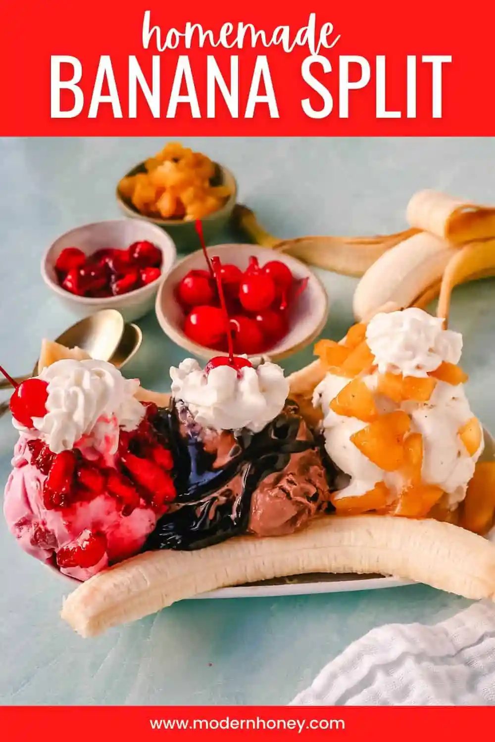 A classic Banana Split recipe made with fresh bananas, chocolate ice cream with hot fudge sauce, strawberry ice cream with strawberry sauce, vanilla ice cream with pineapple sauce, whipped cream, and cherry.
