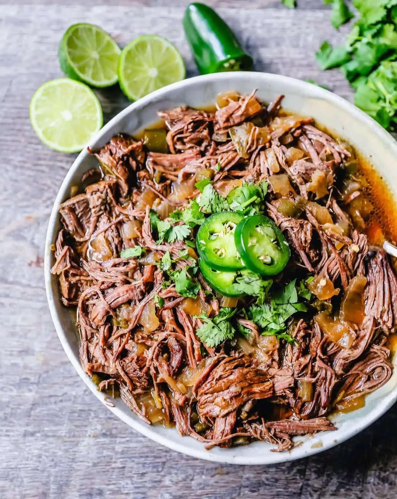 Slow Cooker Barbacoa Beef Tender, flavorful, slow-cooked beef with onions, jalapenos, and spices make this the perfect barbacoa beef for burritos, tacos, enchiladas, quesadillas, on a salad, or just on its own with a few side dishes.