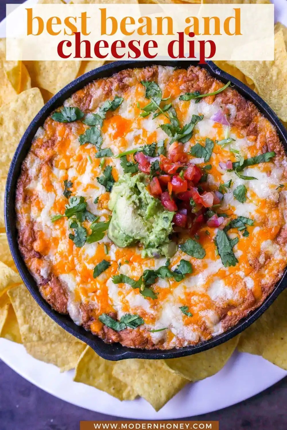 This is the best bean dip recipe ever! This is such an easy bean and cheese dip made with creamy beans, sour cream, cream cheese, taco seasoning, hot sauce, and lots of Mexican cheese! This easy bean dip is the best appetizer recipe.