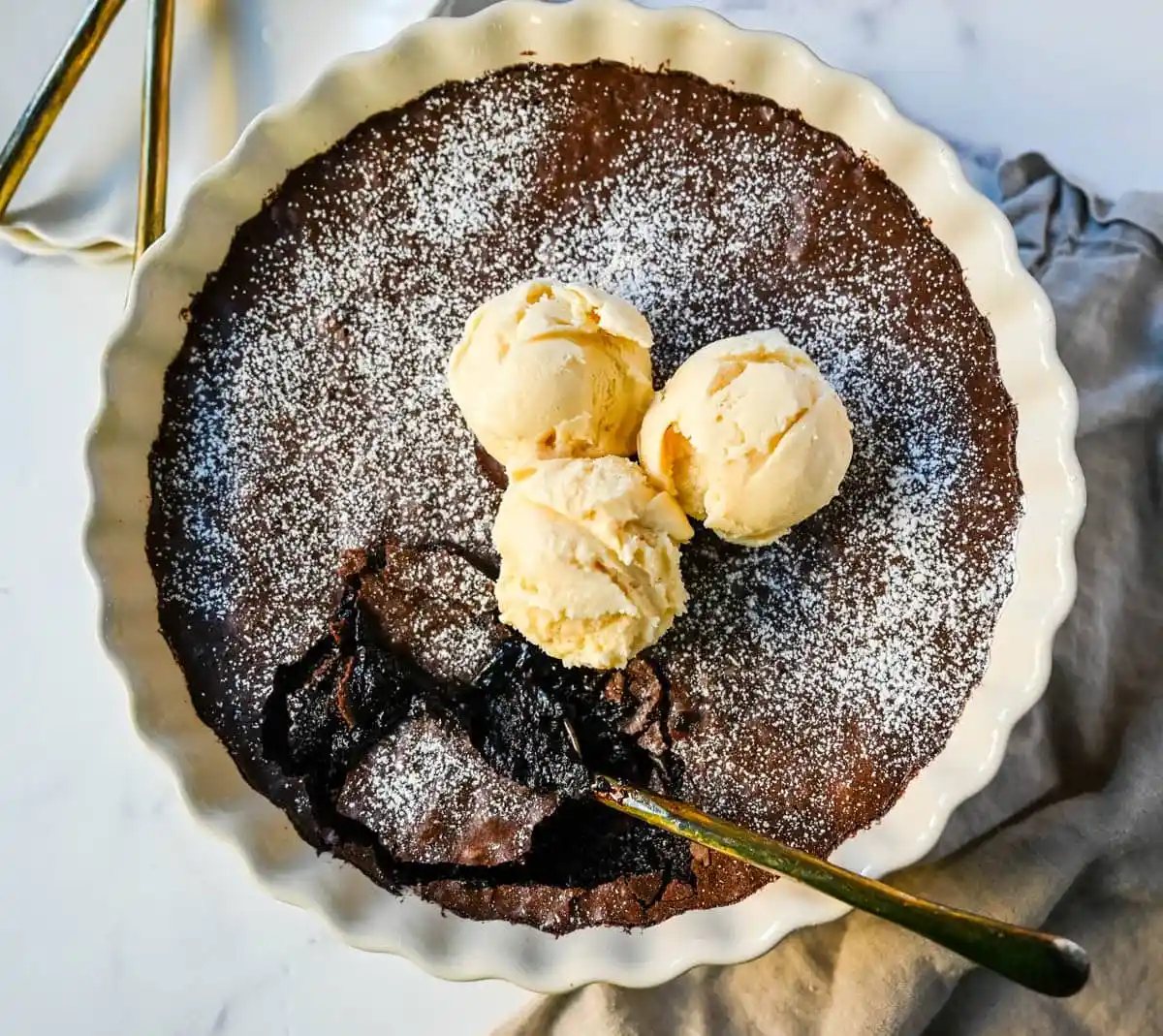 Brownie pudding is the viral, ultra-rich chocolate dessert combining the best parts of brownies and molten lava cake. This easy dessert bakes into a crackly top with a gooey, fudgy, pudding-like center that is chocolate lover's dream dessert. Made famous by Ina Garten, brownie pudding is trending everywhere on TikTok, thanks to its simple ingredients, decadent texture, and rich flavor. You will love Ina Garten's Brownie Pudding recipe!