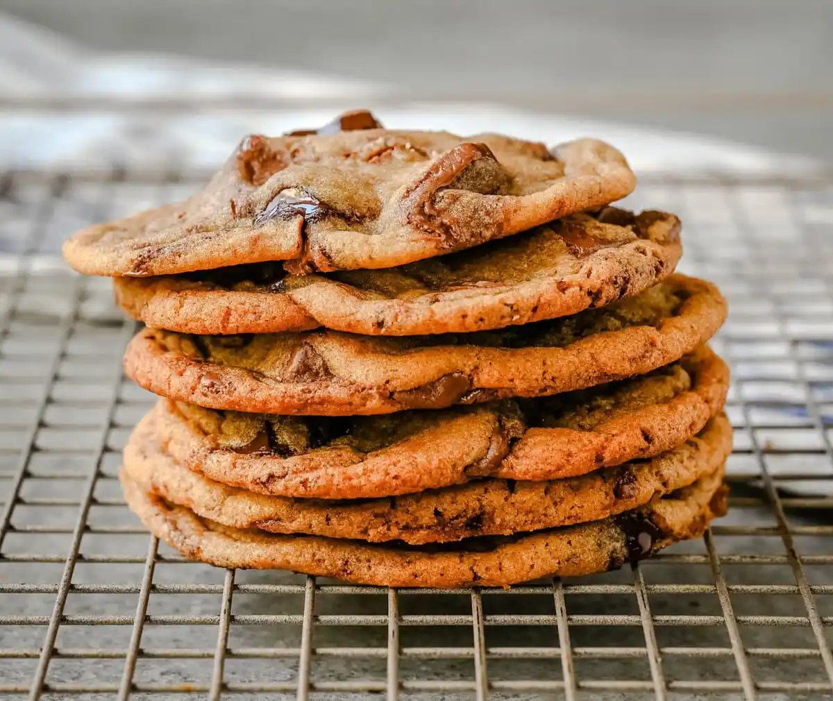 Thin and Chewy chocolate chip cookies stacked