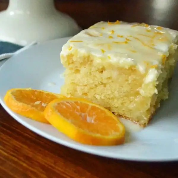 Orange Roll Breakfast Cake. A sweet orange cake with three layers of flavor -- a moist cake topped with a buttery orange topping and a sweet orange cream cheese glaze. The most amazing orange cake! Perfect for a holiday breakfast or dessert. www.modernhoney.com. Plus a wonderful egg nog and ice cream drink recipe.