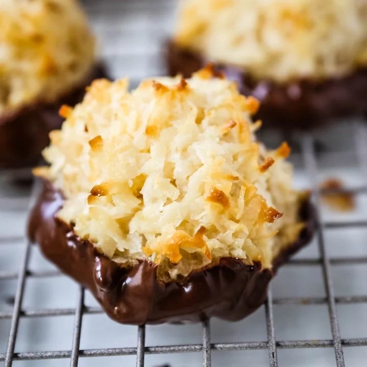 The Best Coconut Macaroons. Soft chewy sweet coconut macaroons are the perfect gluten-free cookie. How to make the perfect coconut macaroons dipped in dark chocolate. www.modernhoney.com #macaroons #coconutmacaroons #macaroon #christmascookie #christmascookies