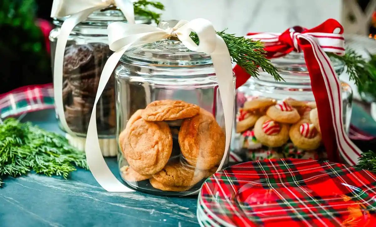 Christmas Cookie Jars. Christmas cookies in glass jars with ribbon.
