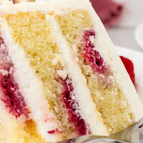 Lemon Raspberry Cake with Lemon Cream Cheese Frosting. A light and fluffy lemon cake with fresh raspberries and a fresh lemon cream cheese frosting. A sweet and tangy lemon berry cake!