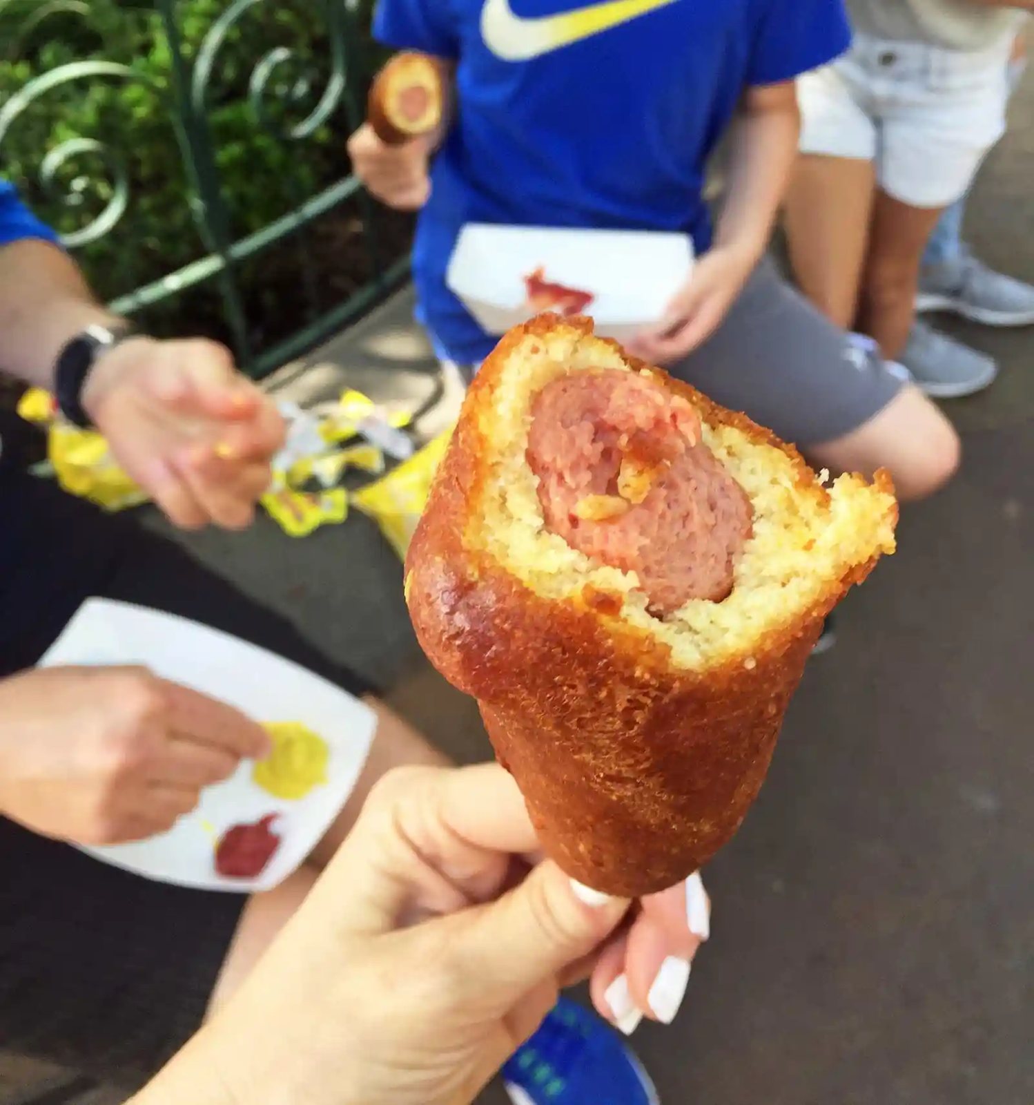 Hand-dipped Corn dog at Disneyland. The Best Eats and Treats at Disneyland. The best food to eat at Disneyland. A list of the most popular and favorite food at Disneyland parks. A list of what to eat at Disneyland. www.modernhoney.com