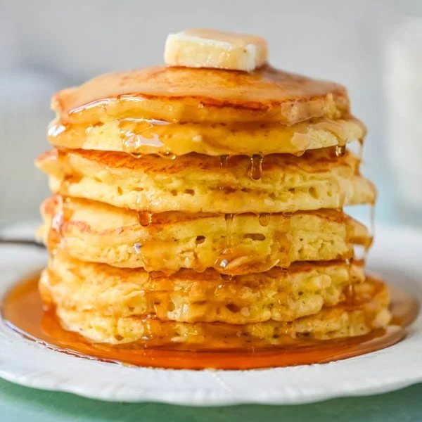 Best Fluffy Pancake Recipe. This is the best pancake recipe from scratch because it uses both whipped egg whites and baking powder, along with rich buttermilk and creamy ricotta, to create incredibly fluffy, light pancakes with a soft, tender interior. The buttermilk adds a subtle tang and helps keep the pancakes moist, while the ricotta brings a rich and creamy texture. The method is simple but effective, giving you consistent results without complicated steps. The combination of these ingredients creates perfect homemade pancakes every time.