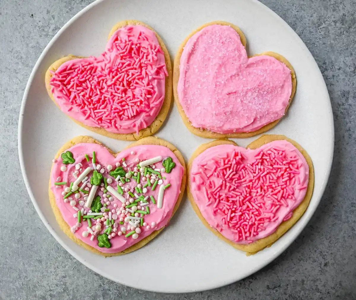 If you are looking for the best soft sugar cookies with frosting, this is the recipe you’ll come back to again and again. These frosted sugar cookies topped with cream cheese frosting bake up perfectly tender and stay soft for days.