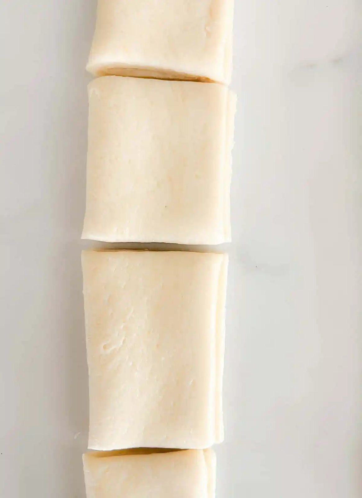 Parker House rolls slicing dough into rolls. How to make homemade Parker House Rolls from scratch.