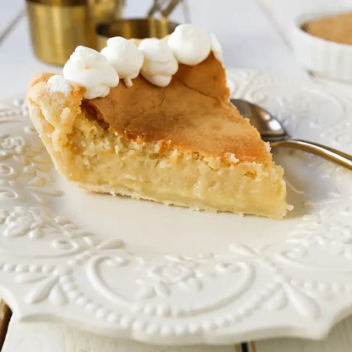 Creme Brûlée Pie. A silky smooth vanilla custard in a buttery crust topped with a crisp sugar topping. It is a creamy sweet pie with a touch of tang and will be everyone's favorite pie! www.modernhoney.com #thanksgiving #pie #pies #thanksgivingrecipes #cremebrulee