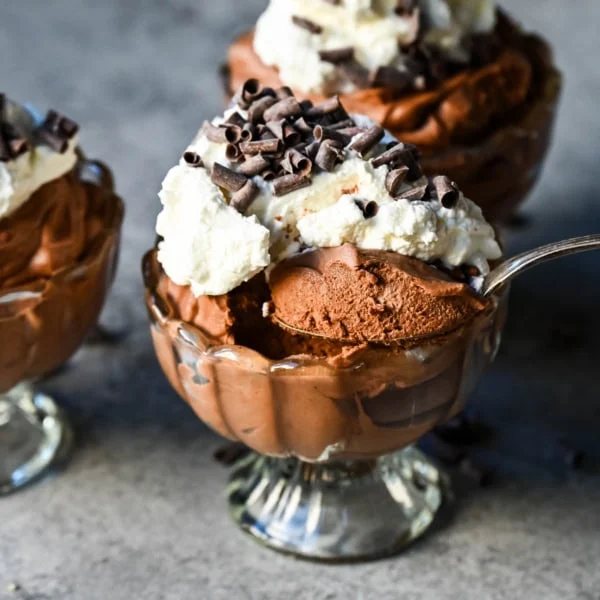 This chocolate mousse recipe is a rich and decadent chocolate dessert but is super simple to make. This is a quick and easy chocolate mousse recipe without eggs and relying on whipped heavy cream for a light and airy texture. This is the best chocolate mousse recipe!