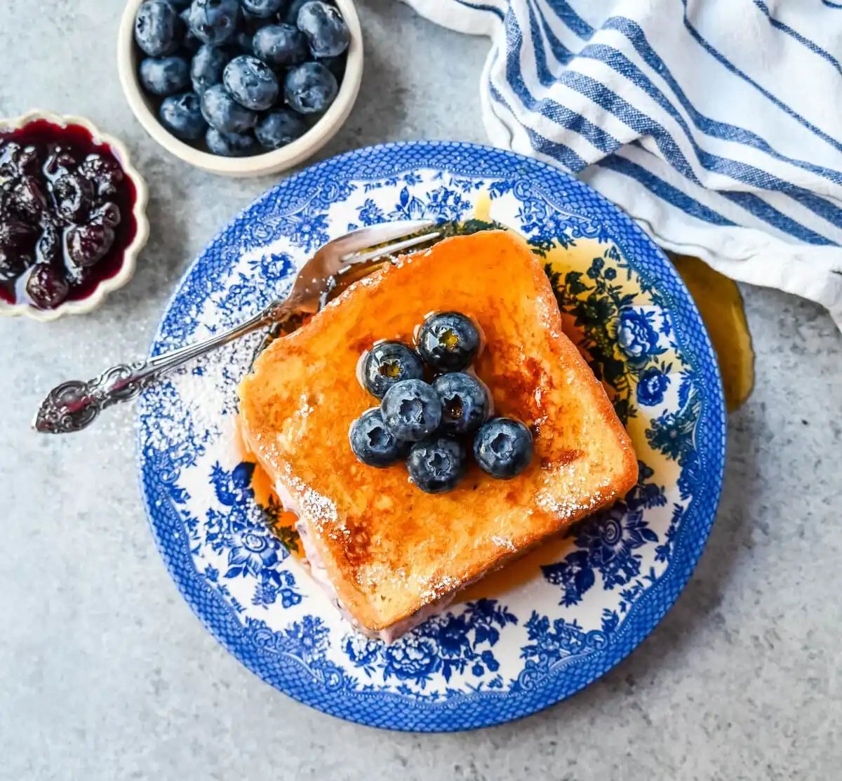 Blueberry Cheesecake Stuffed French Toast. This Blueberry Cream Cheese Stuffed French Toast Recipe is made with soft, thick bread stuffed with a homemade blueberry cream cheese and dipped in a vanilla custard batter and cooked until golden.