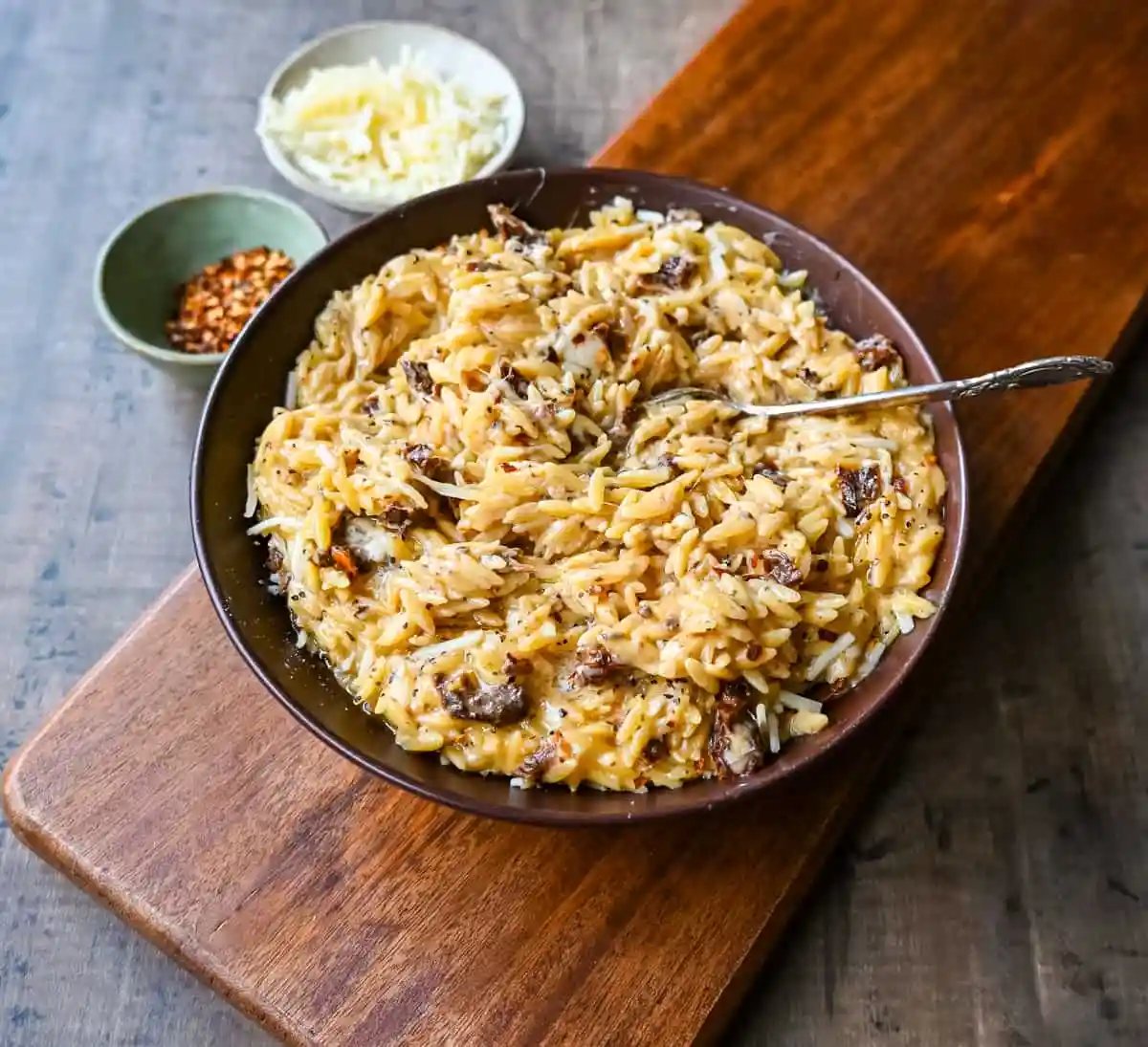 Boursin Cheese Sundried Tomato Orzo. A quick and easy one pot side dish made with orzo pasta in a creamy boursin cheese parmesan sundried tomato sauce.