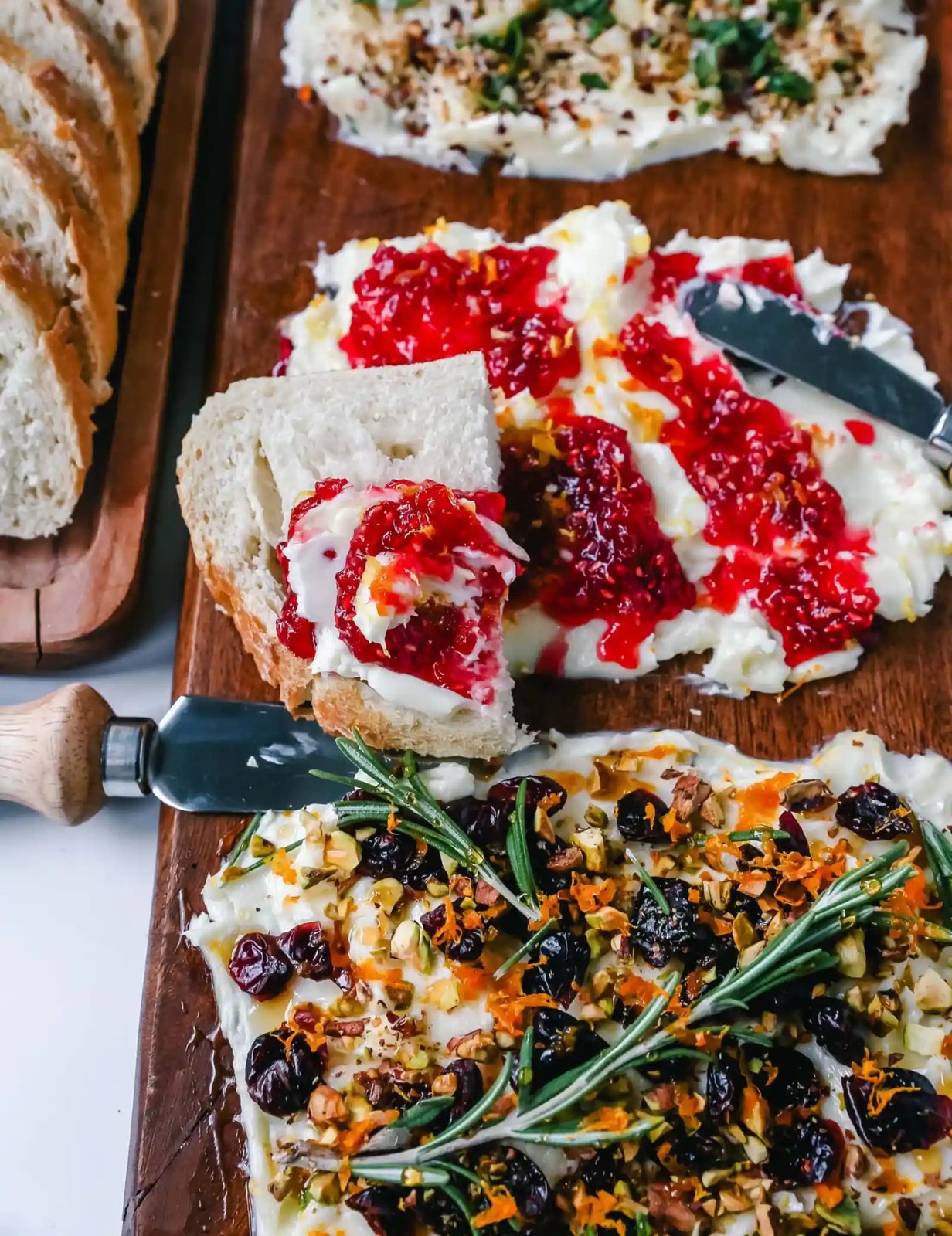 A Butter Board with fresh butter is spread onto a board and topped with an assortment of toppings and served with warm bread. This Butter Board with Toppings is such a fun appetizer for a party!