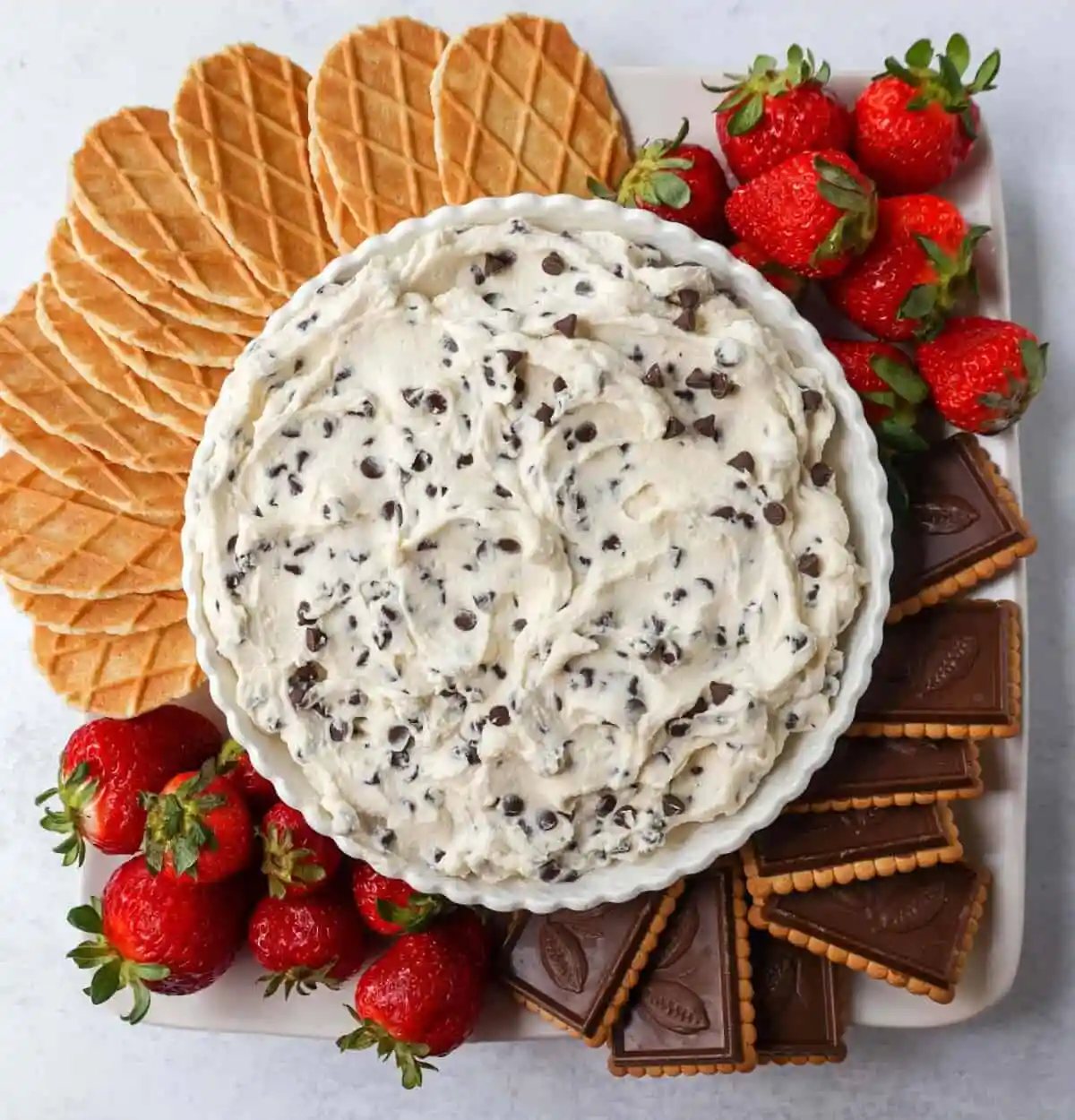 This is the Best Cannoli Dip Recipe made with ricotta cheese, mascarpone or cream cheese, powdered sugar, brown sugar, vanilla, and mini chocolate chips.