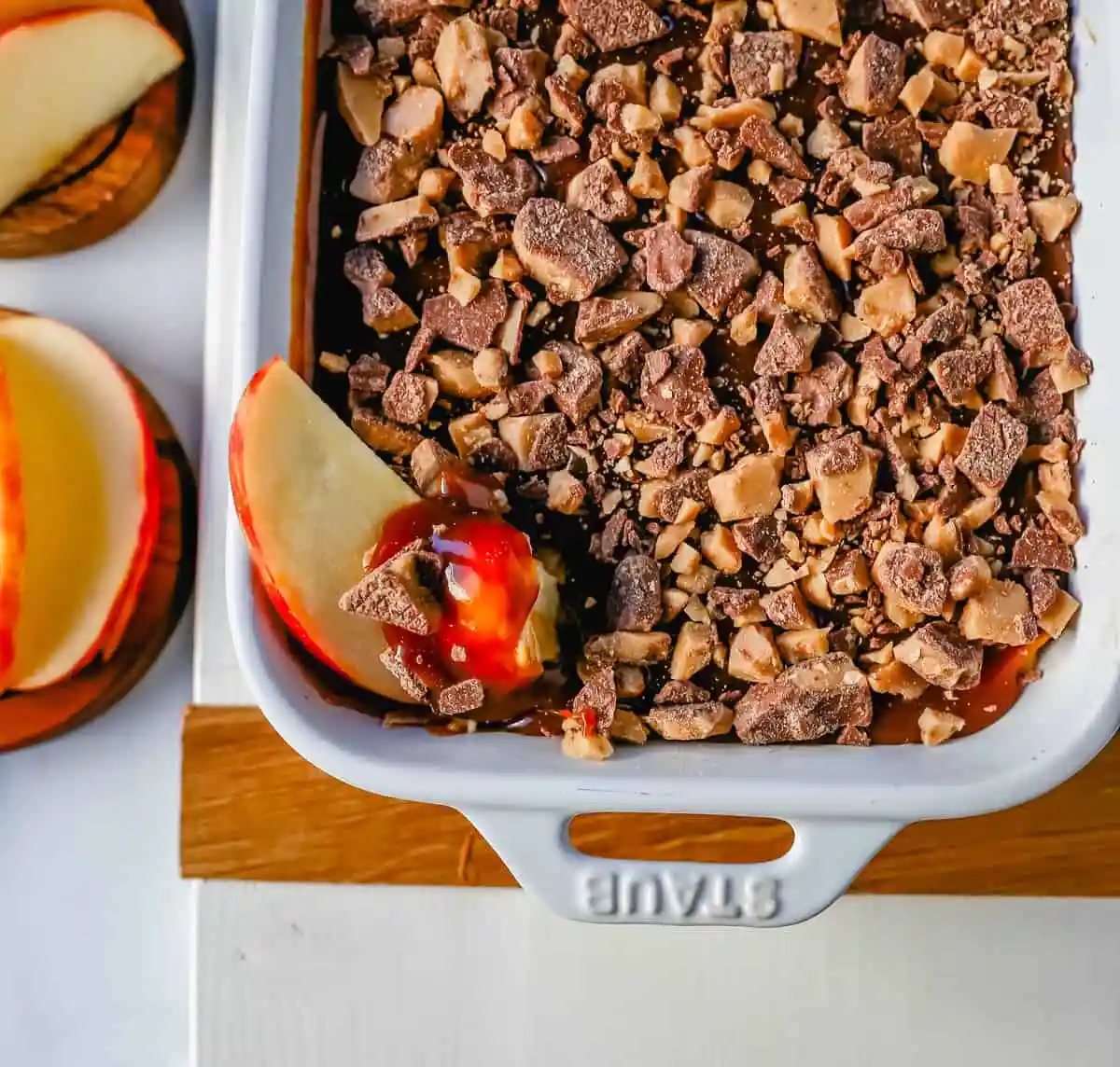 A 5-ingredient Caramel Apple Dip made with cream cheese, brown sugar, vanilla, caramel sauce, and Heath Bar toffee pieces. This is the perfect dip for fresh apples! This Caramel Toffee Dip is the easiest dessert to serve at parties.
