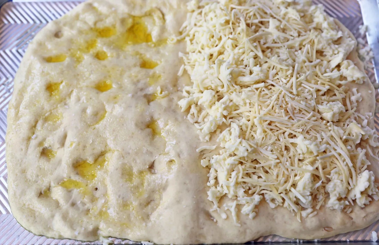 Cheese Focaccia Bread Recipe. How to make garlic cheese focaccia bread from scratch. The best garlic cheese breadsticks. www.moderhoney.com #focaccia