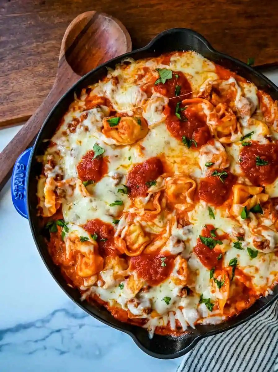 Cheese Tortellini with Sausage Ragu. This quick and easy 20 minute pasta bake is made with cheese tortellini in an Italian sausage ragu sauce and topped with cheesy melted mozzarella cheese. Everyone loves this easy pasta dinner made with only 5 ingredients!
