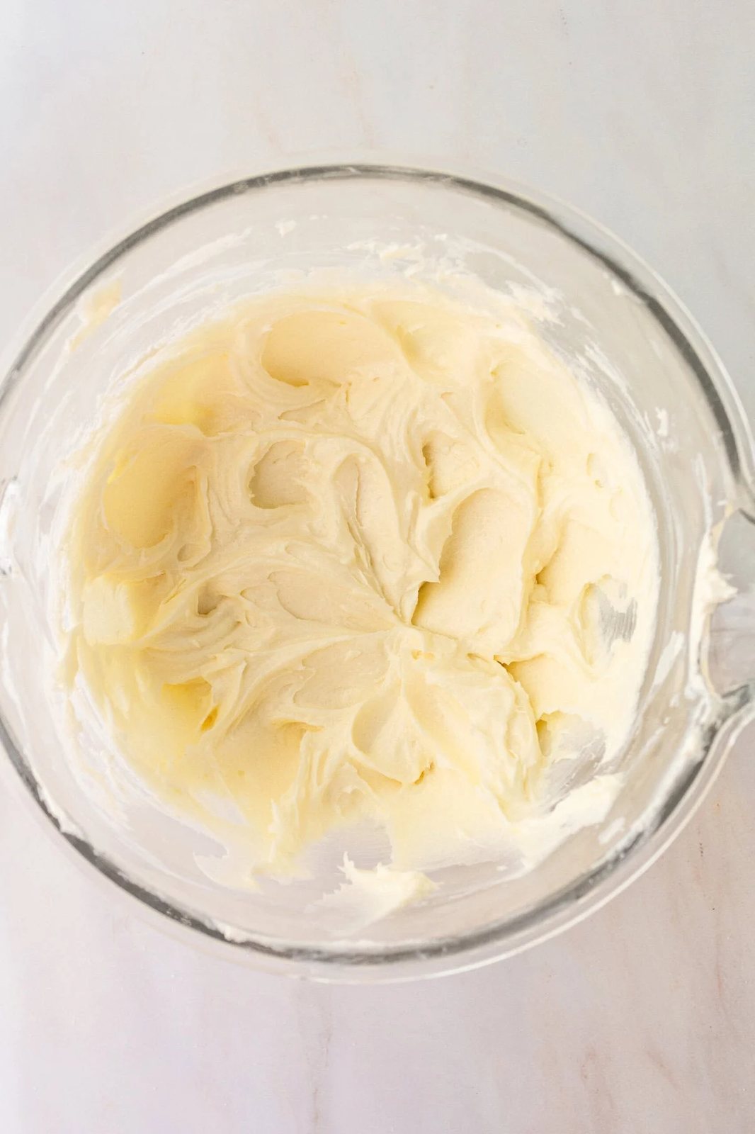 Cheesecake Bars Cheesecake Filling whipped in a bowl. How to make the filling for cheesecake bars.