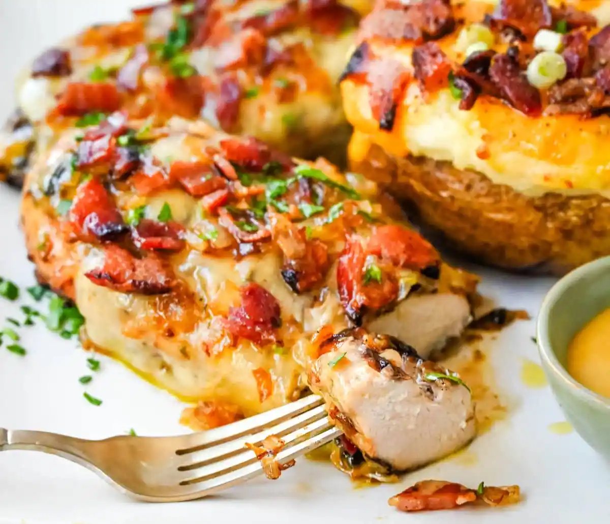 Cheesy Bacon Smothered Chicken. This juicy, marinated grilled chicken breast is smothered with honey mustard sauce, melted cheese, and crispy bacon. To make it extra flavorful, add caramelized onions or mushrooms. You may know this as the famous Alice Springs Chicken from Outback Steakhouse but you can make it at home.