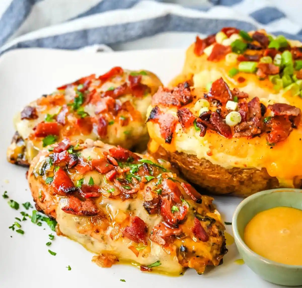 Cheesy Bacon Smothered Chicken. This juicy, marinated grilled chicken breast is smothered with honey mustard sauce, melted cheese, and crispy bacon. To make it extra flavorful, add caramelized onions or mushrooms. You may know this as the famous Alice Springs Chicken from Outback Steakhouse but you can make it at home.