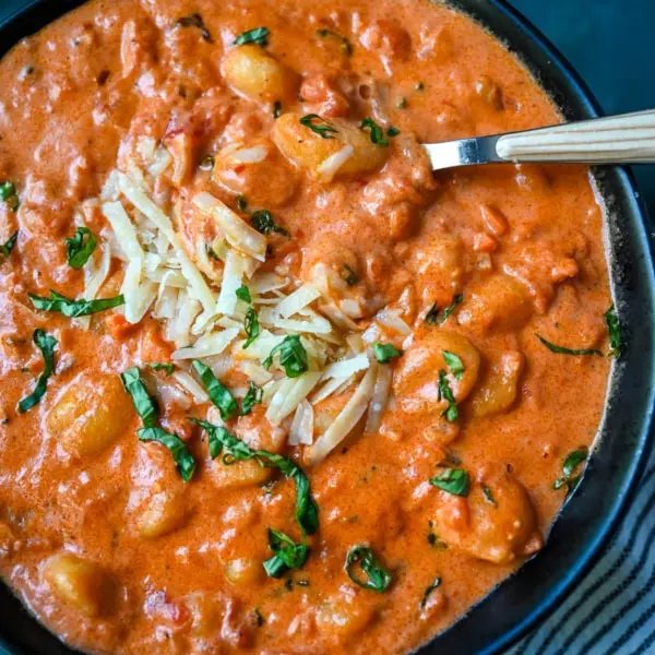 This easy Gnocchi alla Vodka combines soft, tender gnocchi with a silky, tomato-cream vodka sauce that’s bursting with garlic, parmesan, and fresh basil. This Gnocchi with Tomato Cream Sauce is an easy weeknight dinner but it tastes like it is straight out of an Italian restaurant.