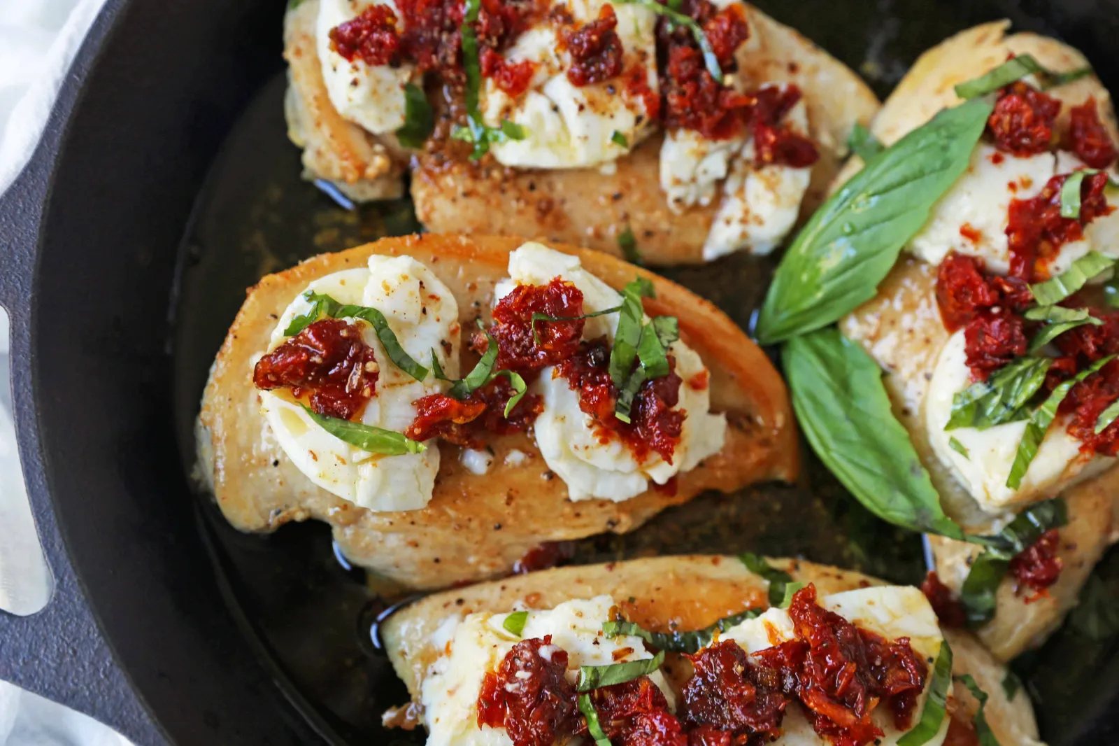 Chicken Bryan. Grilled chicken with a basil lemon butter sauce topped with sundried tomatoes and creamy goat cheese. A Carrabba's favorite! www.modernhoney.com #chickenbryan #carrabbas #chicken