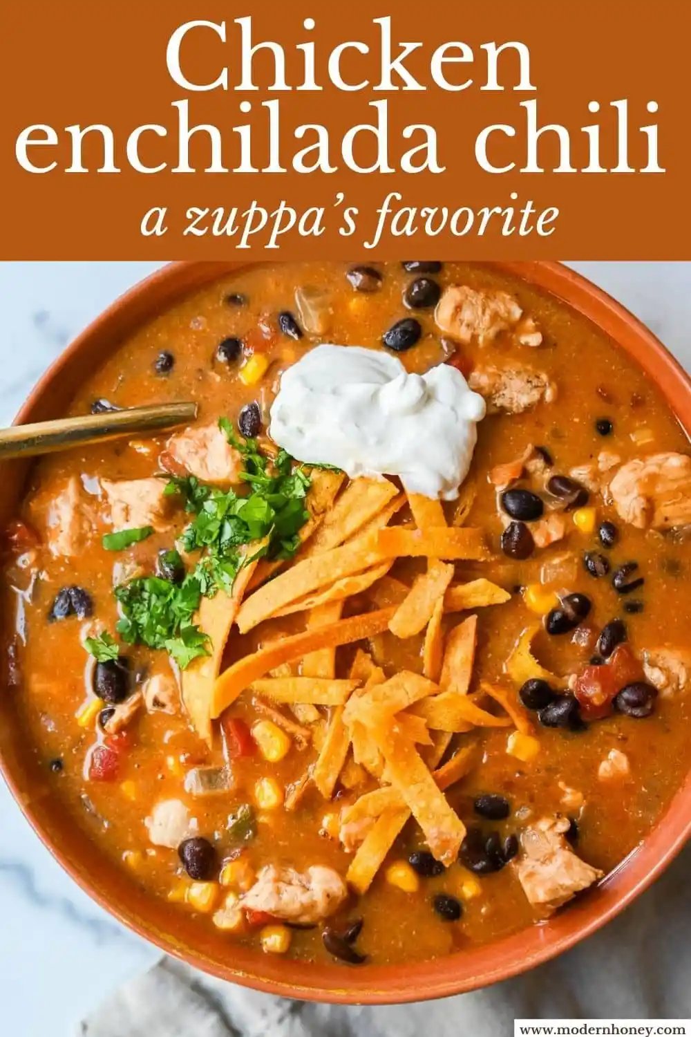 If you love enchiladas, you’ll love this Chicken Enchilada Chili. Made with tender chicken, red and green enchilada sauce, black beans, fire roasted corn and cheese, it’s rich, creamy, and incredibly comforting. This Chicken Enchilada Soup is a delicious one pot dinner recipe that is full of so much flavor!