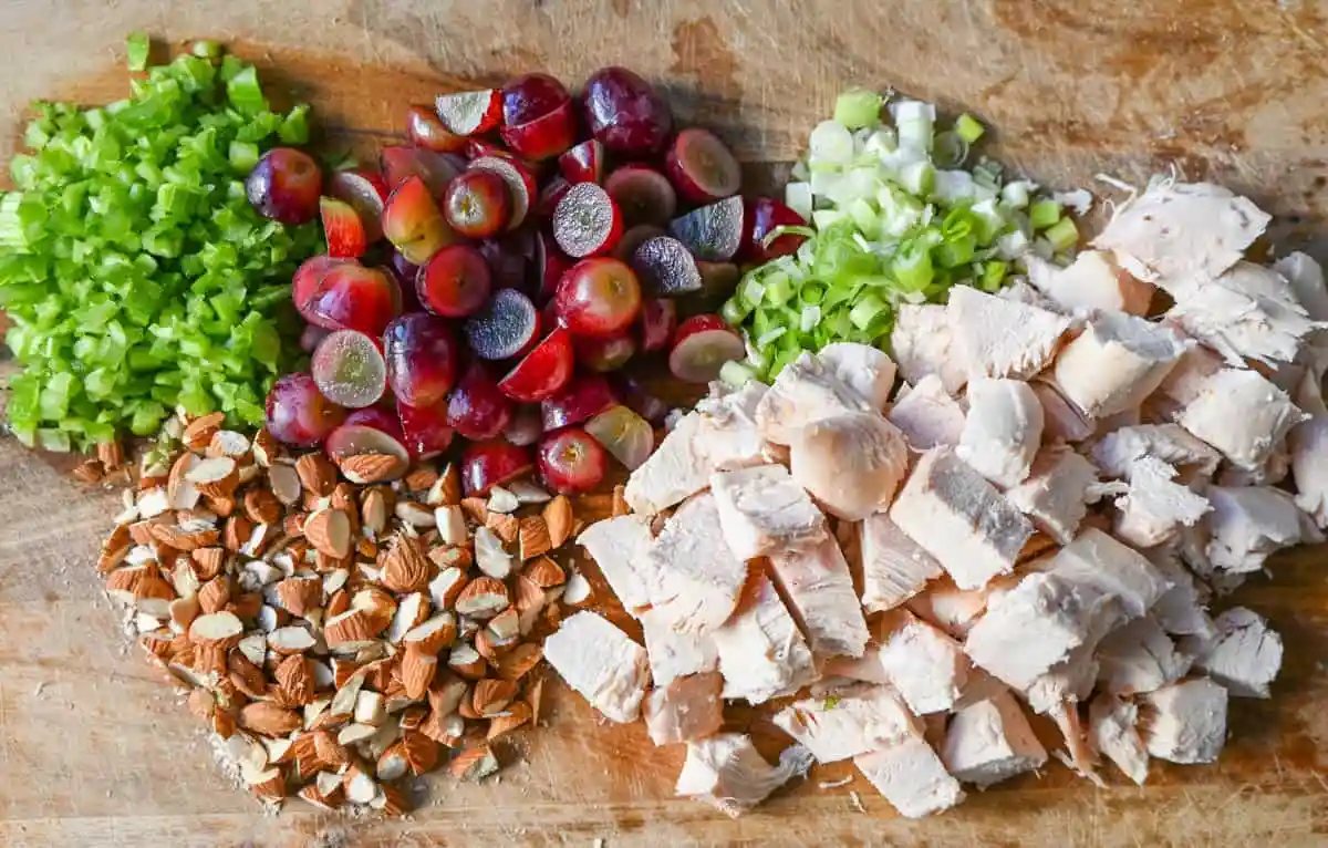 Chicken Salad Ingredients Chicken, Celery, Green Onion, Grapes, Almonds, Mayonnaise.