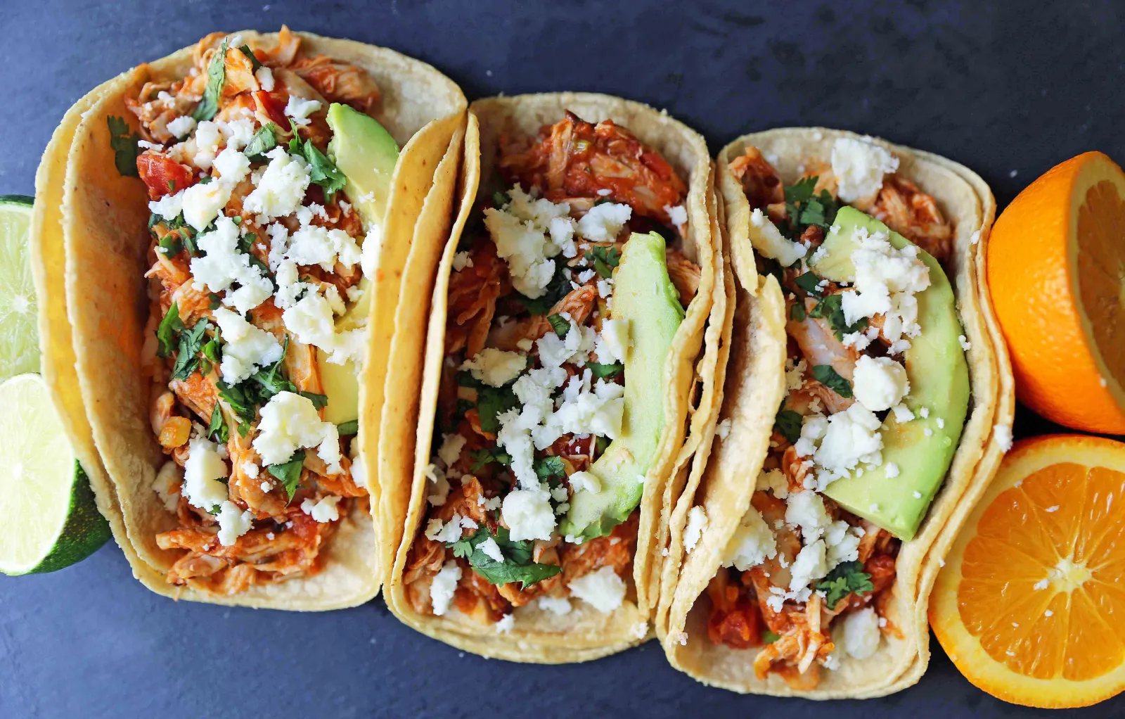 Chipotle Chicken Tinga Tacos. A simple, quick, and easy chicken taco recipe. One skillet chicken taco recipe. www.modernhoney.com #chickentinga #chipotlechicken #chickentacos #chickentingatacos