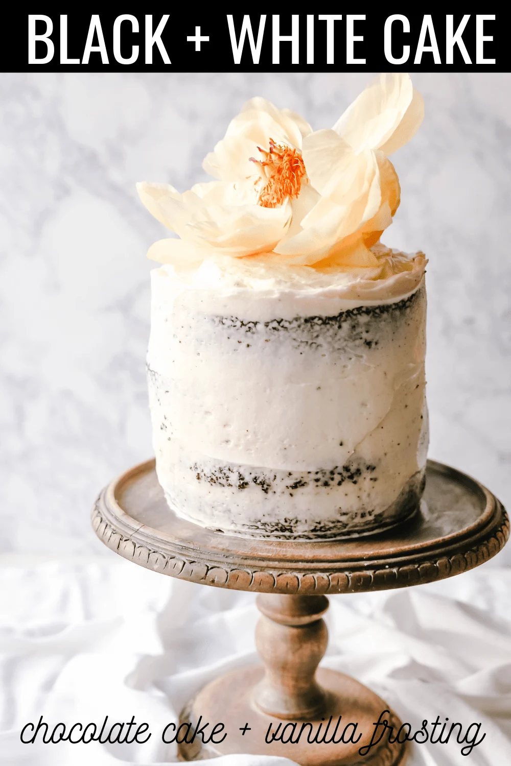 Black and White Cake -- Chocolate Cake with Vanilla Frosting Rich, moist homemade chocolate cake with a creamy vanilla bean frosting with a touch of cream cheese. The perfect Black and White Cake!