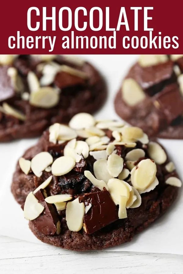 Chocolate Cherry Almond Cookies. Decadent chocolate chunk cookies with dried cherries and sliced almonds. A rich chocolate cherry chunk cookie! www.modernhoney.com #cherrychocolatecookies #chocolatecherrycookies #chocolatecookies #chocolatecookie
