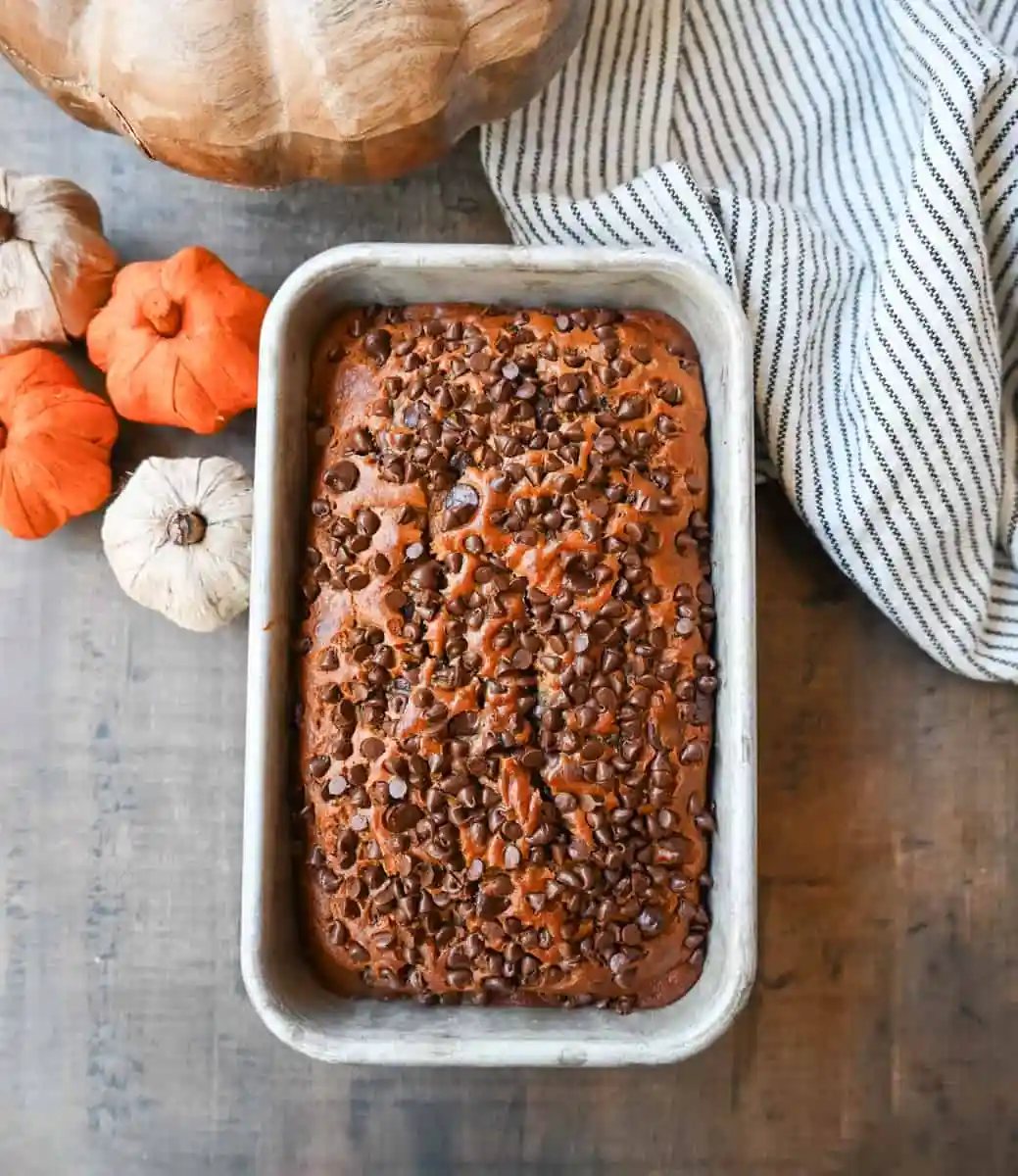 How to make the best pumpkin chocolate chip bread ever! This moist pumpkin spiced bread with chocolate chips will be a Fall favorite. It is the most perfect chocolate chip pumpkin bread.