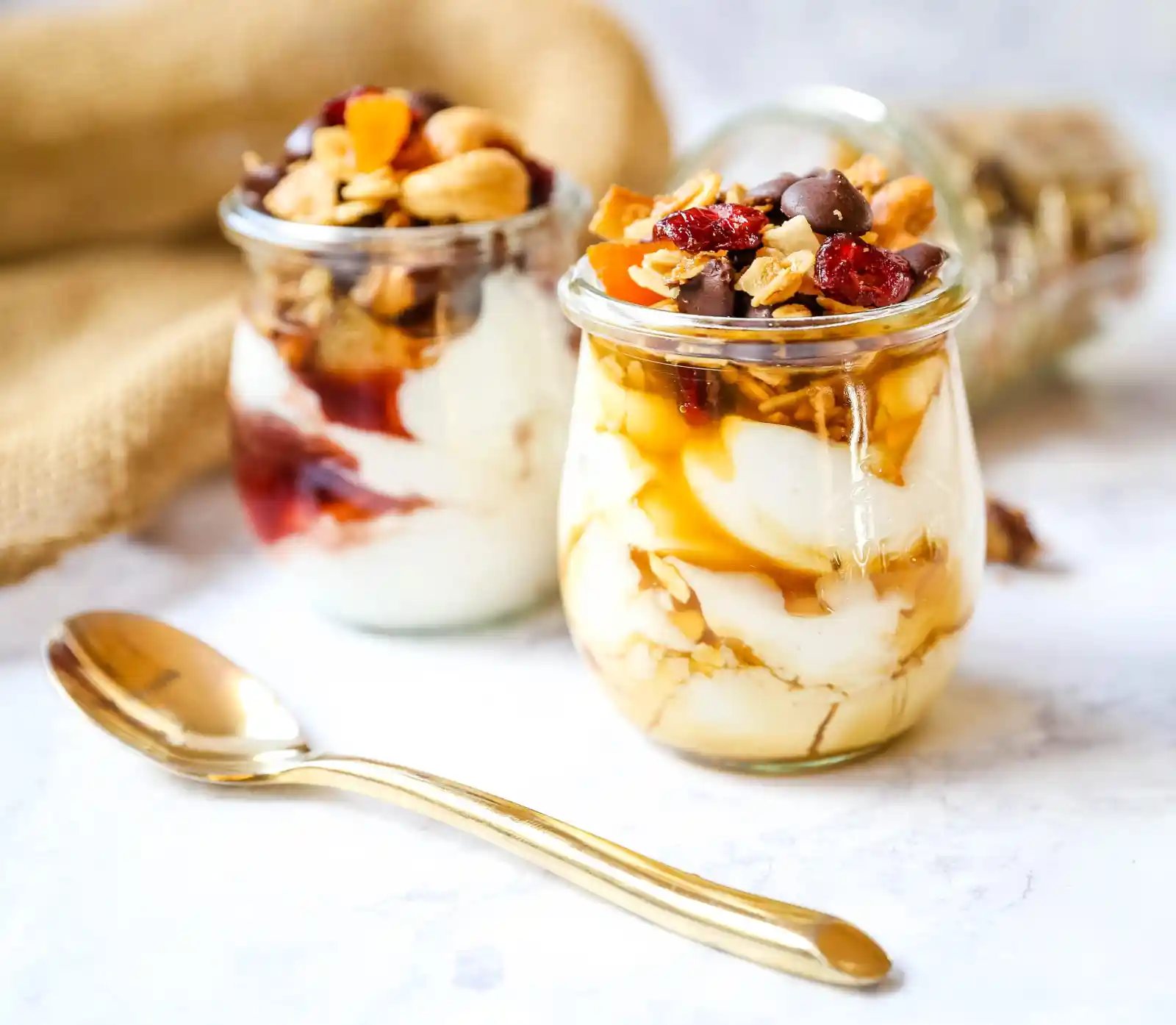 Chocolate Coconut Granola. A decadent chocolate coconut granola with cashews, dried cranberries, apricots, almonds, coconut flakes, and chocolate chips. The best Chocolate Coconut Granola Recipe. www.modernhoney.com #granola #chocolatecoconutgranola #granolarecipe