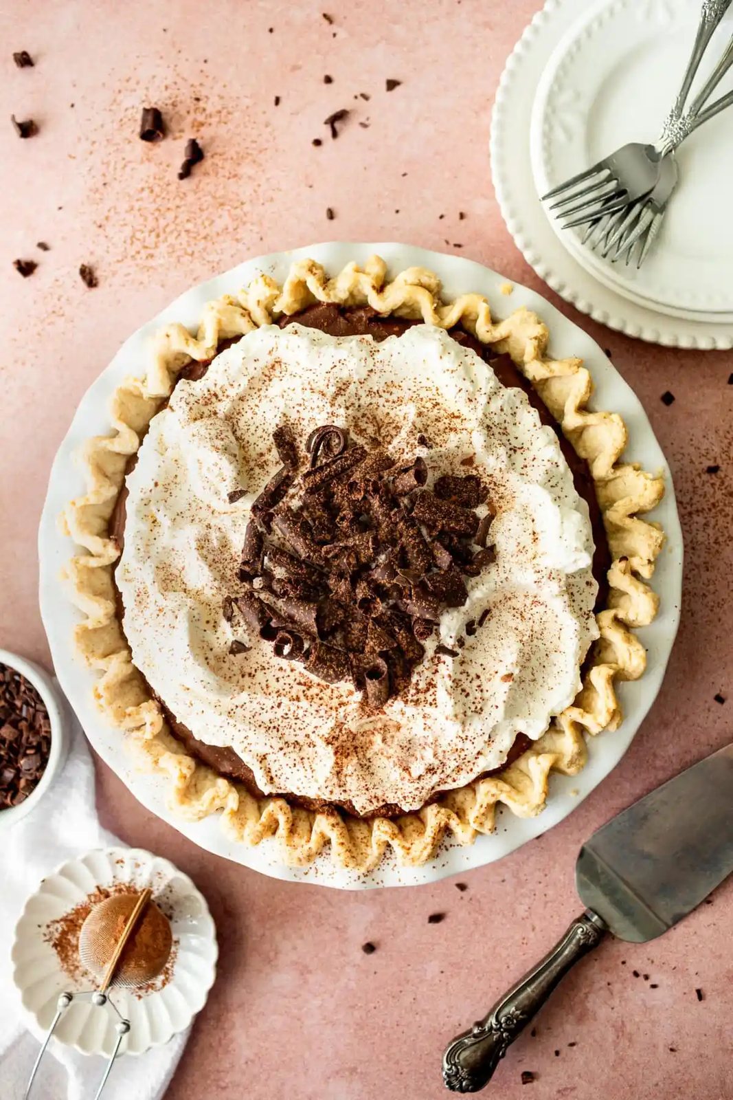 This is the best Chocolate Cream Pie recipe made with decadent chocolate custard in a flaky, buttery crust and topped with homemade whipped cream and chocolate shavings. You will love this chocolate pie recipe!