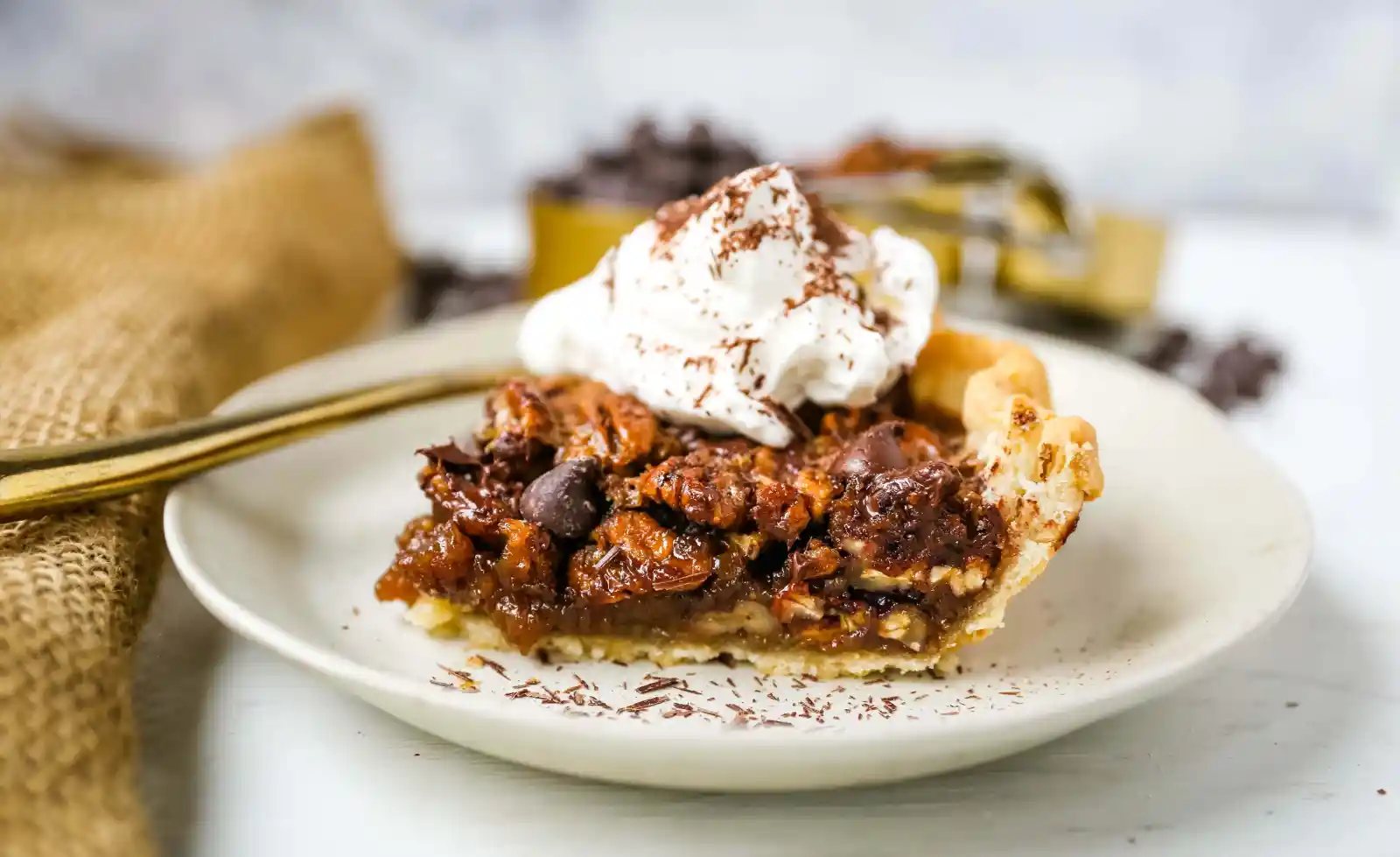 Chocolate Pecan Pie Rich chocolate pecan pie made with a brown sugar filling, crunchy pecans, rich chocolate, all in a homemade buttery, flaky pie crust. www.modernhoney.com #pie #pecanpie #chocolatepecanpie #thanksgiving #pies