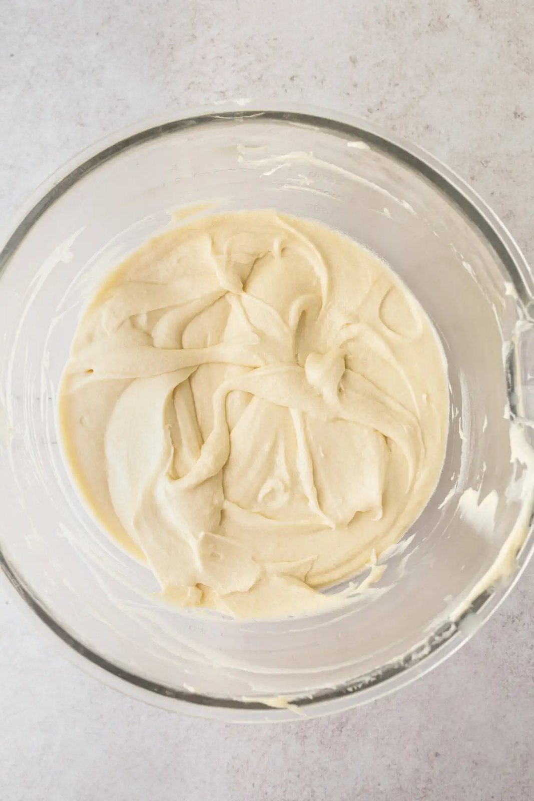 Homemade Coconut Cake Batter in a bowl. How to make coconut cake.