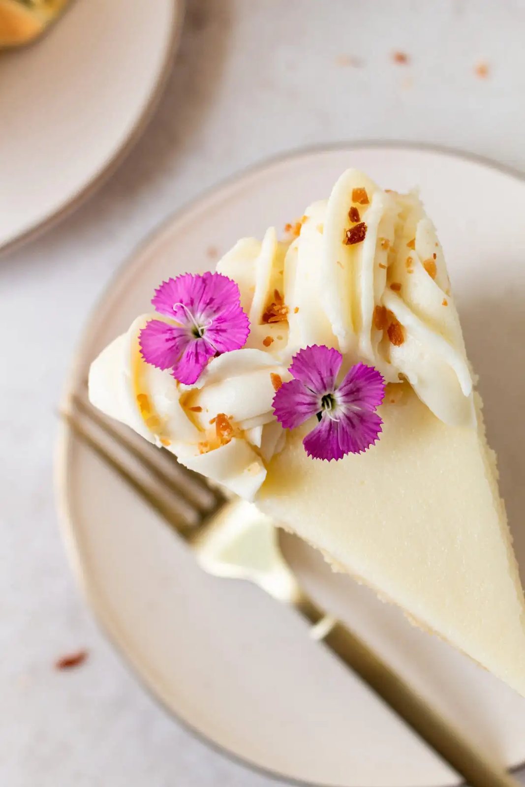 This homemade, moist coconut cake with coconut cream cheese frosting is the best coconut cake recipe. It is made with sweet cream butter, coconut milk, buttermilk, coconut pudding mix, and cake flour to make it extra tender. The coconut cream cheese frosting puts it over the top!