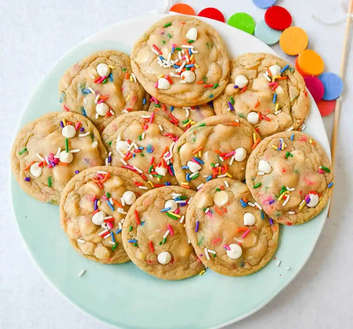 Soft, chewy sugar cookies filled with sprinkles and white chocolate. This festive funfetti cookie recipe has the perfect chewy center with buttery crisp edges filled with rainbow sprinkles.
